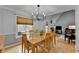 Elegant dining room with hardwood floors, plenty of seating, and natural light at 4995 Hyde Ct, Cumming, GA 30040