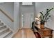 Inviting foyer with hardwood floors, a staircase, and stylish decor, creating a warm ambiance at 4995 Hyde Ct, Cumming, GA 30040