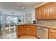 Well-lit kitchen featuring stainless steel appliances, granite countertops, and an open dining space at 4995 Hyde Ct, Cumming, GA 30040