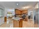 Spacious kitchen featuring granite countertops, stainless steel appliances, and wood cabinets at 4995 Hyde Ct, Cumming, GA 30040