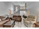 Inviting living room with a soaring ceiling, staircase, and comfortable furnishings at 4995 Hyde Ct, Cumming, GA 30040