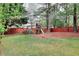 Large backyard with wooden playset and mature shade trees at 2570 Middleton Way, Grayson, GA 30017
