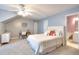 Cozy bedroom with carpet, desk, ceiling fan and attached bathroom at 2570 Middleton Way, Grayson, GA 30017