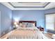 Bright primary bedroom with a trey ceiling and carpeted floors at 2570 Middleton Way, Grayson, GA 30017