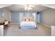 Comfortable bedroom with carpet, ceiling fan, desk and attached bathroom at 2570 Middleton Way, Grayson, GA 30017