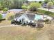 Aerial view of community clubhouse, pool, and tennis courts surrounded by lush greenery at 2570 Middleton Way, Grayson, GA 30017