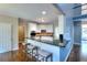 Modern kitchen with granite counters, stainless appliances, and breakfast bar seating at 2570 Middleton Way, Grayson, GA 30017
