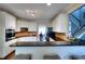 Modern kitchen with dark countertops, stainless steel appliances, and backsplash at 2570 Middleton Way, Grayson, GA 30017