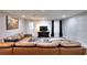 Cozy living room featuring a plush leather sectional sofa and large area rug at 2570 Middleton Way, Grayson, GA 30017