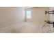 Bedroom featuring a mounted tv stand, a window and light walls with neutral carpet flooring at 3019 Iona Ct, Snellville, GA 30039