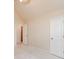 Bedroom showcasing an open doorway, light-colored carpet, and a ceiling fan, offering comfort at 3019 Iona Ct, Snellville, GA 30039