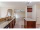 Well-equipped kitchen featuring granite countertops, dark wood cabinets, and open access to the living area at 3019 Iona Ct, Snellville, GA 30039