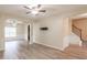 Open-concept living room with hardwood floors, archways, and recessed lighting at 3019 Iona Ct, Snellville, GA 30039