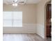 Bright living room with hardwood floors, coffered ceilings, and views into the kitchen at 3019 Iona Ct, Snellville, GA 30039