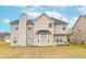 Back of house view highlighting architecture and outdoor space at 3019 Iona Ct, Snellville, GA 30039