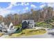 Aerial view of a spacious two-story home with a large lot and mature trees at 4835 Fields Bridge Rd, Cumming, GA 30028