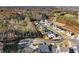 An aerial view shows a new community with modern homes surrounded by natural beauty at 4835 Fields Bridge Rd, Cumming, GA 30028