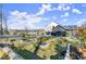The backyard features tiered landscaping, a manicured lawn, and neighborhood views at 4835 Fields Bridge Rd, Cumming, GA 30028