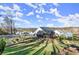 A landscaped backyard and the rear of a modern two-story home in a desirable community at 4835 Fields Bridge Rd, Cumming, GA 30028