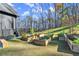 Inviting backyard featuring a vegetable garden and a tree line at 4835 Fields Bridge Rd, Cumming, GA 30028
