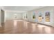 Large finished basement area featuring wood flooring and multiple windows at 4835 Fields Bridge Rd, Cumming, GA 30028