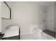 Bright bathroom featuring marble walk-in shower and sleek white vanity at 4835 Fields Bridge Rd, Cumming, GA 30028