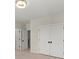 Bedroom featuring a chandelier, doors and neutral walls at 4835 Fields Bridge Rd, Cumming, GA 30028
