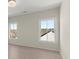 Bedroom featuring a modern chandelier and two large windows at 4835 Fields Bridge Rd, Cumming, GA 30028