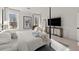 Light-filled bedroom with four-poster bed, stylish decor, and large windows at 4835 Fields Bridge Rd, Cumming, GA 30028