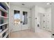 Bright hallway with hardwood floors and view to double-door entry at 4835 Fields Bridge Rd, Cumming, GA 30028