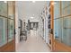 Hallway showcasing built-in bookshelves and hardwood floors at 4835 Fields Bridge Rd, Cumming, GA 30028