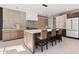 Modern kitchen featuring a large island with seating and stainless steel appliances at 4835 Fields Bridge Rd, Cumming, GA 30028