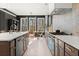 Modern open concept kitchen with large island and view into the dining room at 4835 Fields Bridge Rd, Cumming, GA 30028