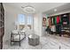 Bright walk-in closet with natural light, chair, and open shelving offering ample storage space at 4835 Fields Bridge Rd, Cumming, GA 30028