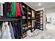 Walk-in closet featuring open shelving and hanging racks for clothing and accessories at 4835 Fields Bridge Rd, Cumming, GA 30028