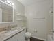 Bathroom featuring a granite vanity top, cabinet, and tile backsplash and shower at 6351 Wedgeview Ct, Tucker, GA 30084