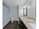Remodeled bathroom featuring double sinks, granite counters, and updated shower at 6351 Wedgeview Ct, Tucker, GA 30084