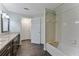 Bathroom with granite countertops and shower-tub combination at 6351 Wedgeview Ct, Tucker, GA 30084