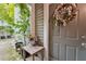 Charming home entrance with decorative wreath and vibrant flower accents at 6351 Wedgeview Ct, Tucker, GA 30084