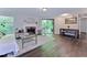 Bright living room featuring a fireplace, sliding glass doors, and hardwood flooring at 6351 Wedgeview Ct, Tucker, GA 30084