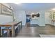 Bright living room featuring hardwood floors with access to kitchen and entranceway at 6351 Wedgeview Ct, Tucker, GA 30084