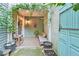 This outdoor patio is decorated with potted plants and furniture at 6351 Wedgeview Ct, Tucker, GA 30084