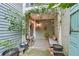 This outdoor patio is decorated with potted plants and furniture at 6351 Wedgeview Ct, Tucker, GA 30084