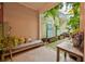 Inviting patio with a daybed, plant decor, and serene outdoor seating at 6351 Wedgeview Ct, Tucker, GA 30084