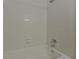 Bathroom shower featuring white subway tile and a built-in soap dish at 6351 Wedgeview Ct, Tucker, GA 30084