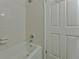 Bathroom shower featuring white subway tile and a white door at 6351 Wedgeview Ct, Tucker, GA 30084