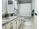 Clean bathroom with double vanity, granite countertops, and modern fixtures and shower and tub at 9030 Brockham Way, Johns Creek, GA 30022