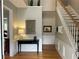 Elegant foyer featuring a staircase, hardwood floors, and decorative accents at 9030 Brockham Way, Johns Creek, GA 30022