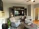 Living room featuring built-in shelving and cabinet with dual chairs and round accent table at 9030 Brockham Way, Johns Creek, GA 30022
