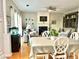 Inviting living room with a fireplace, hardwood floors, and cozy seating, perfect for relaxation and entertaining at 9030 Brockham Way, Johns Creek, GA 30022